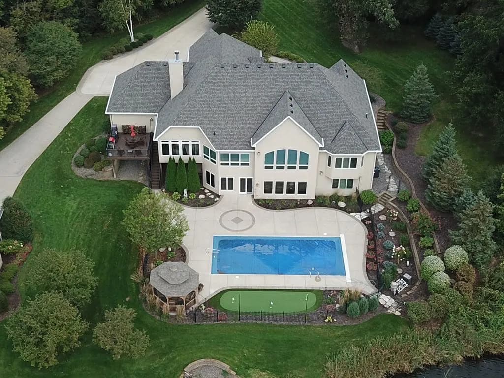 Aerial view of a completed roof replacement on a luxury Twin Cities home